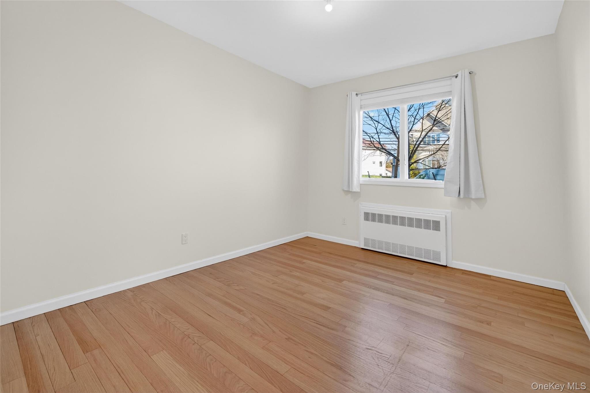 2 Bluefield Drive, Unit 103 Spring Valley, NY 10977 - Photo 31 of 42 wooden floor in a empty room