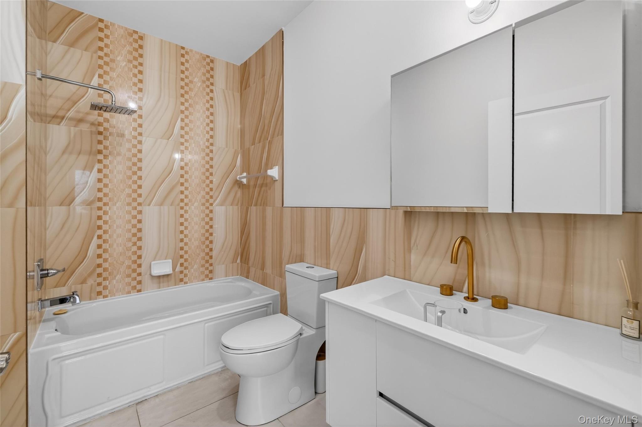 2 Bluefield Drive, Unit 103 Spring Valley, NY 10977 - Photo 36 of 42 a bathroom with a sink a toilet and a bathtub
