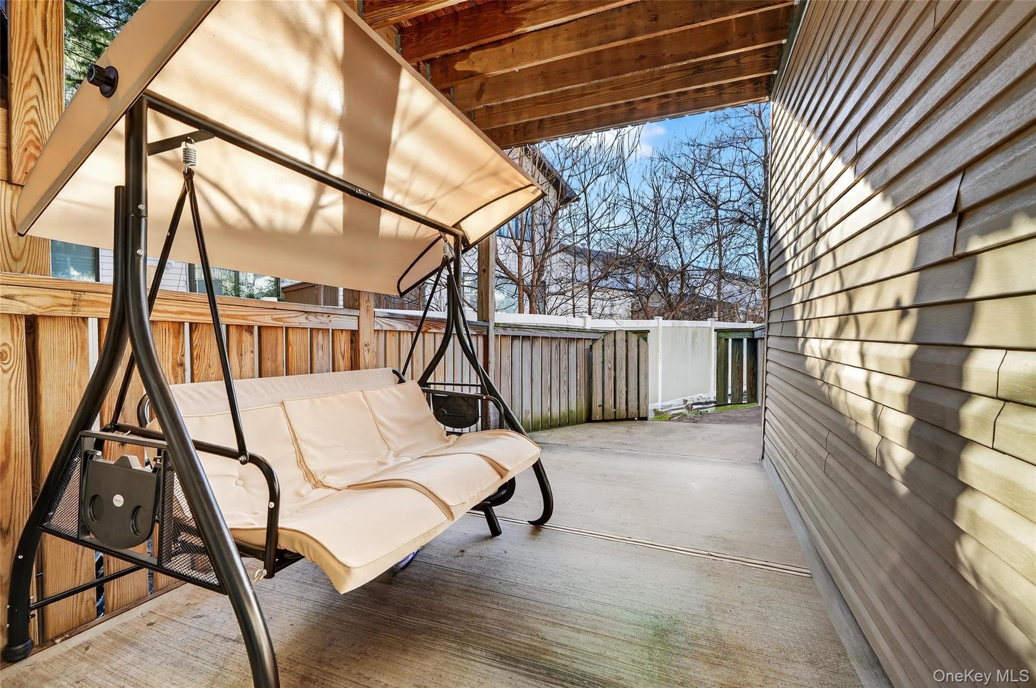 2 Bluefield Drive, Unit 103 Spring Valley, NY 10977 - Photo 37 of 42 Fenced backyard featuring a patio area