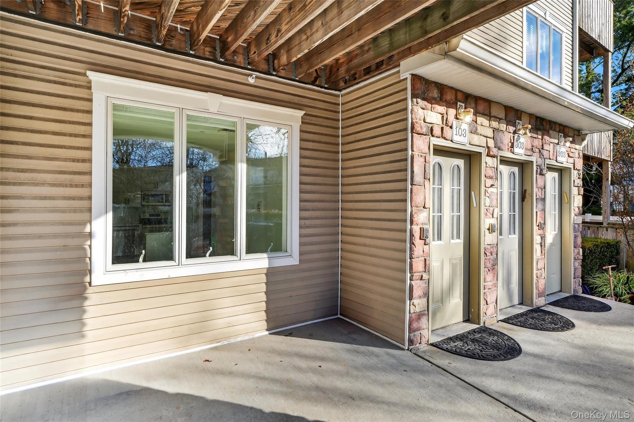 2 Bluefield Drive, Unit 103 Spring Valley, NY 10977 - Photo 39 of 42 Property entrance with stone siding