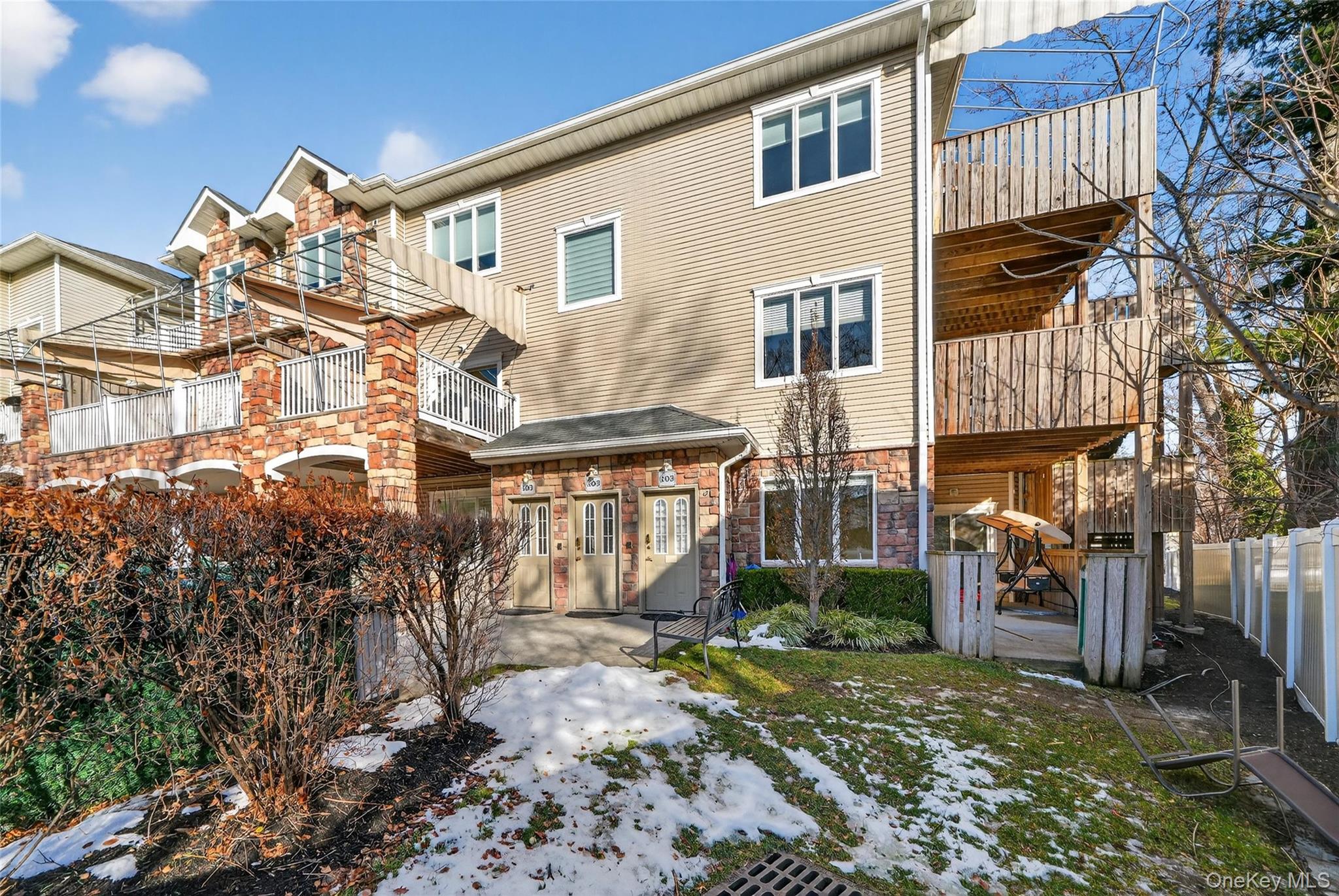 2 Bluefield Drive, Unit 103 Spring Valley, NY 10977 - Photo 40 of 42 a front view of a house with a yard