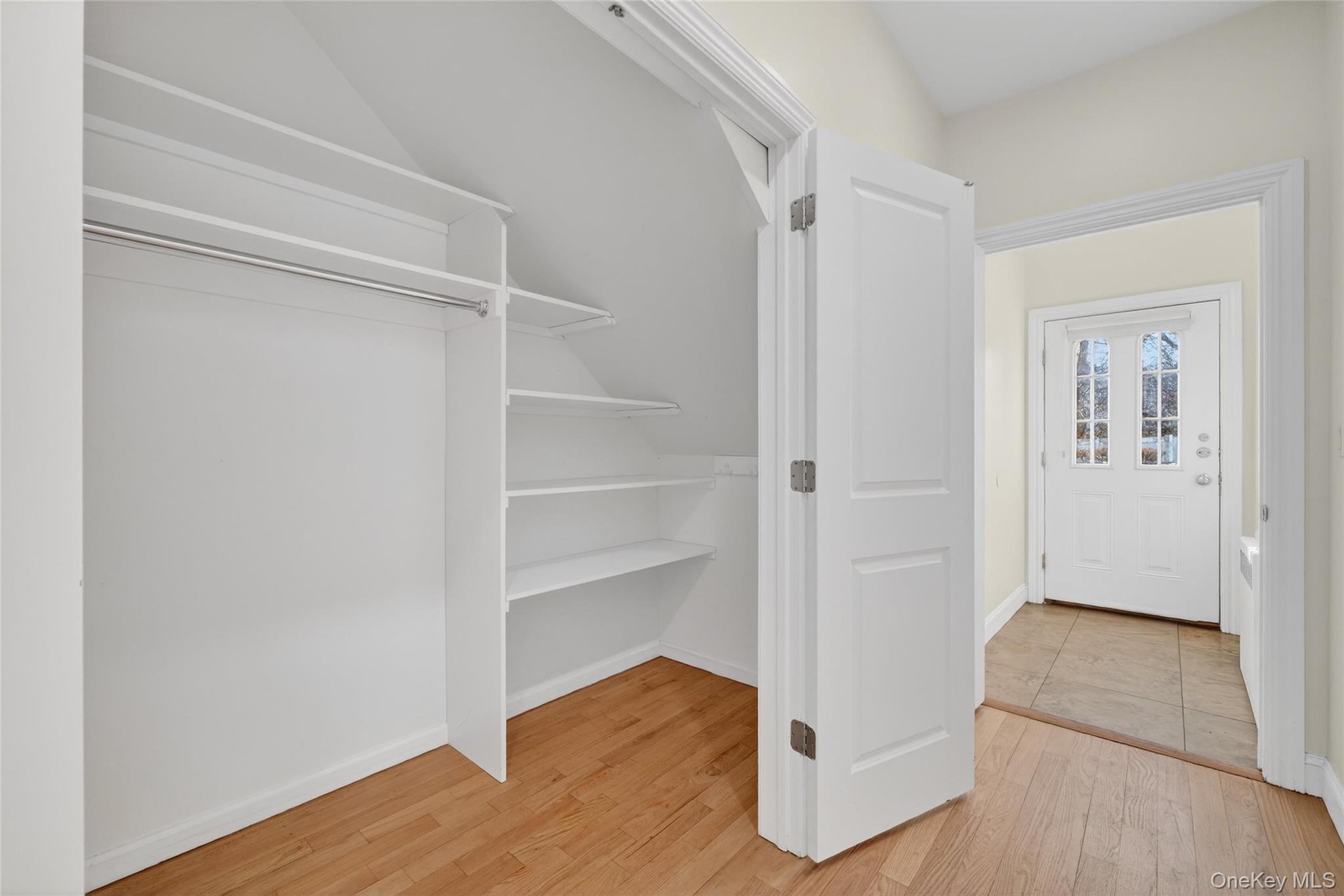 2 Bluefield Drive, Unit 103 Spring Valley, NY 10977 - Photo 4 of 42 a view of an empty room with wooden floor and closet
