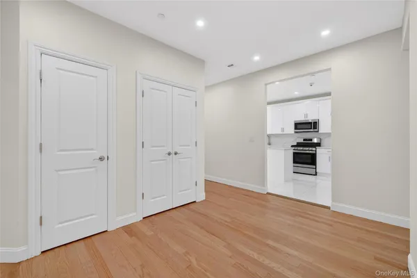 a kitchen with cabinets stainless steel appliances and a counter space