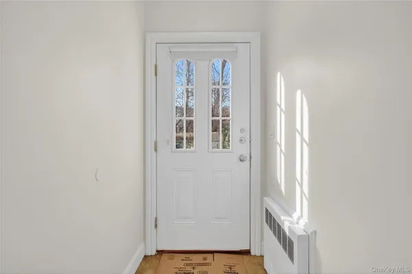 a kitchen with kitchen island a counter top space a refrigerator and cabinets