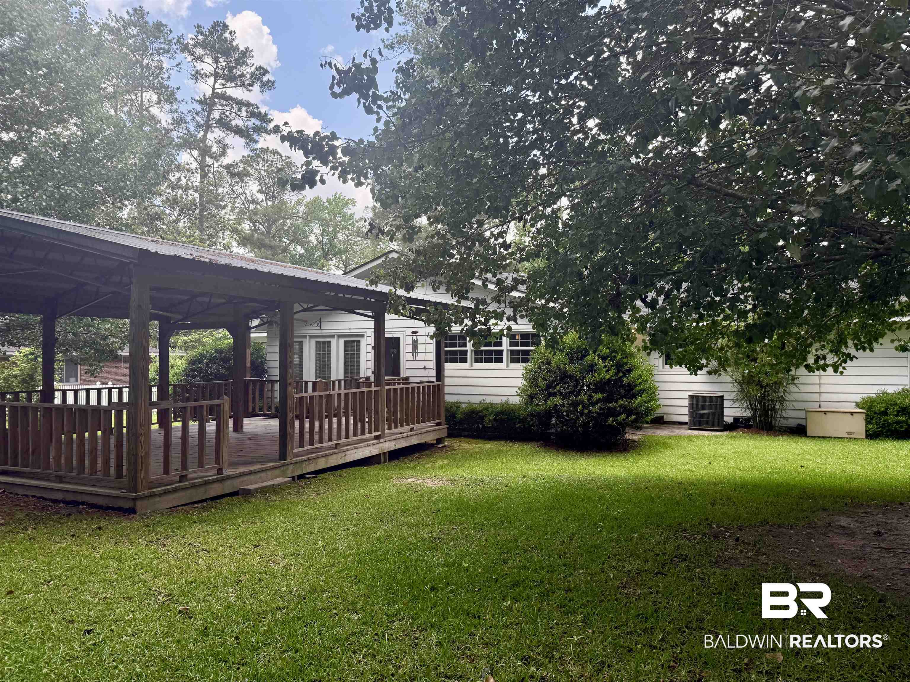 1412 Poplar Avenue Brewton, AL 36426 - Photo 28 of 32 View of green lawn with a wooden deck