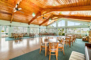 a view of a swimming pool with outdoor seating