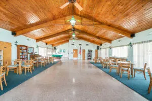 a view of a swimming pool with outdoor seating