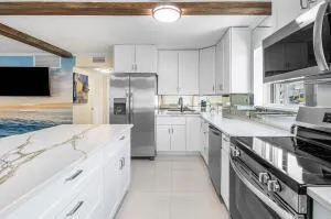 a kitchen with a sink stove and refrigerator