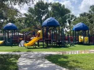 a view of a house with a yard and sitting area