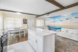 a view of a kitchen with kitchen island granite countertop lots of counter top space