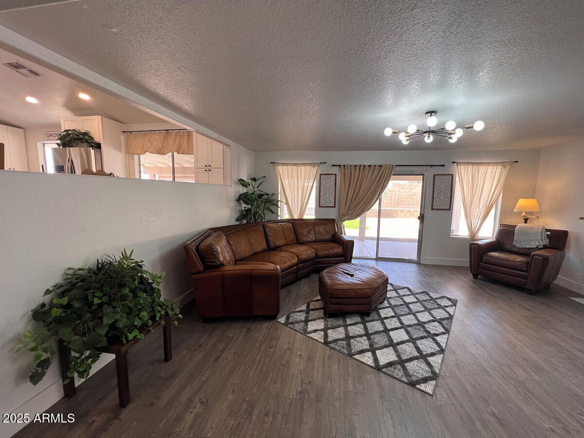 8322 West McLellan Road Glendale, AZ 85305 - Photo 11 of 30 a living room with furniture and a large window