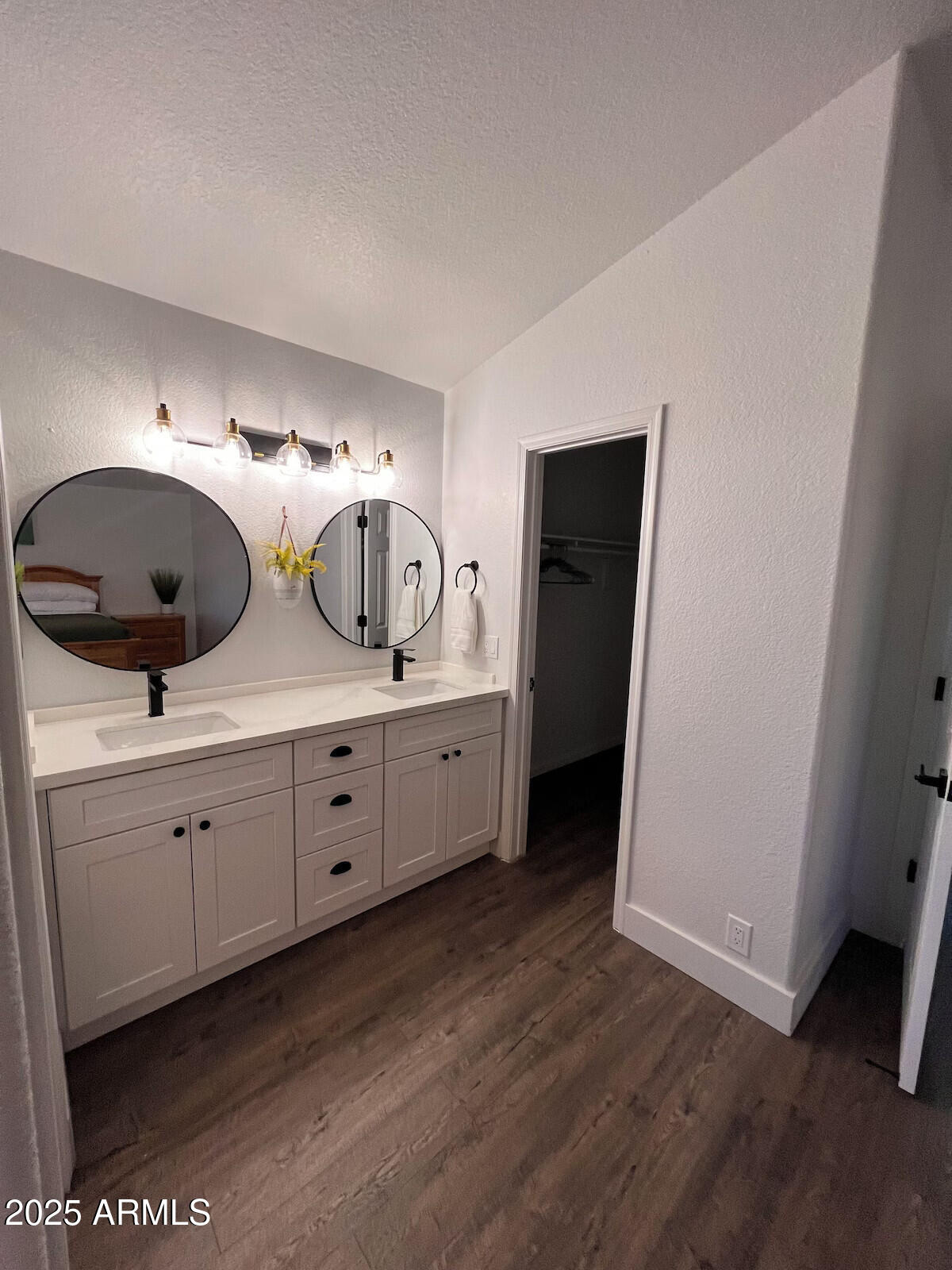 8322 West McLellan Road Glendale, AZ 85305 - Photo 17 of 30 a spacious bathroom with double vanity and mirrors