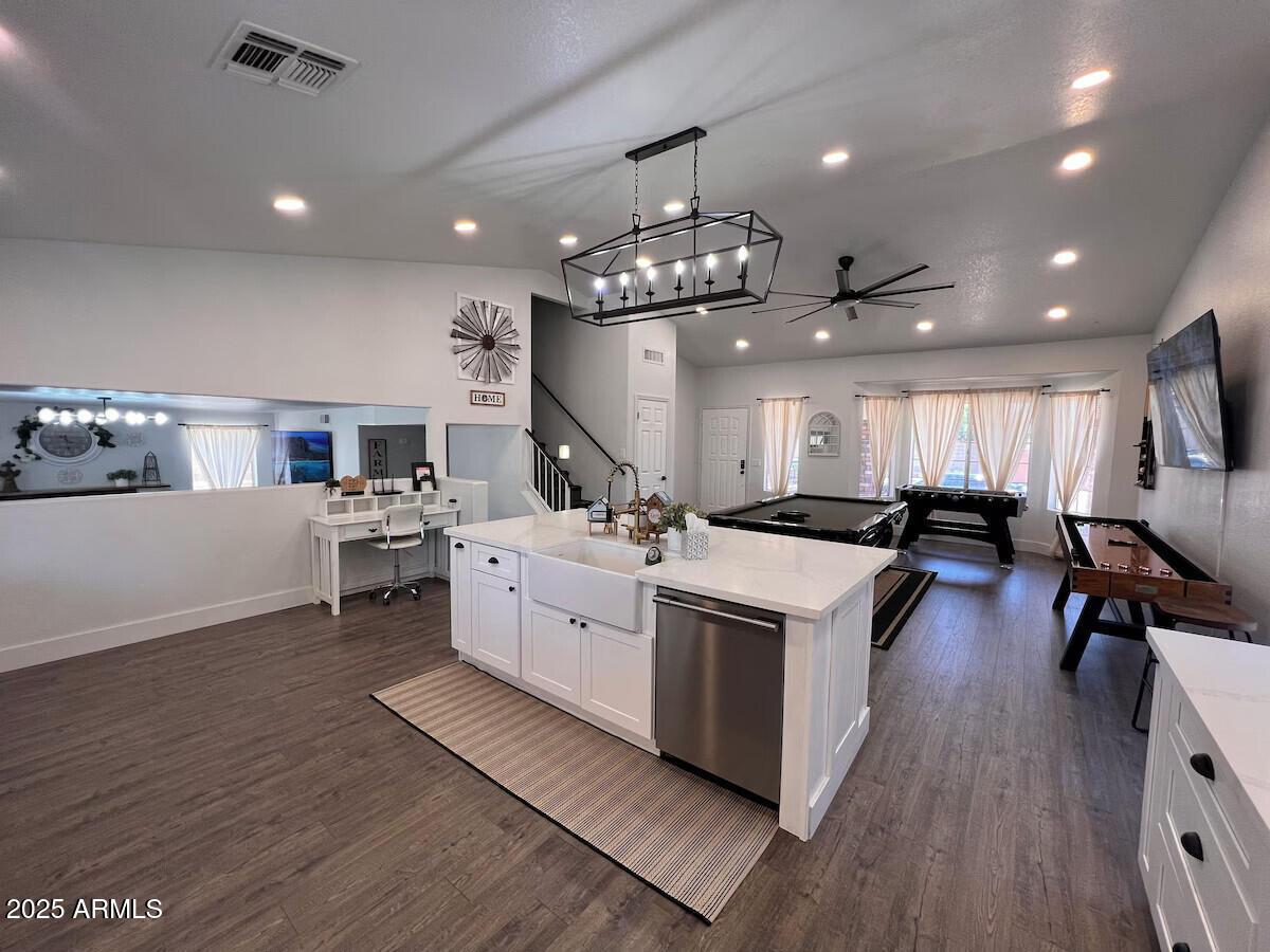 8322 West McLellan Road Glendale, AZ 85305 - Photo 2 of 30 a large white kitchen with lots of counter space a sink and appliances
