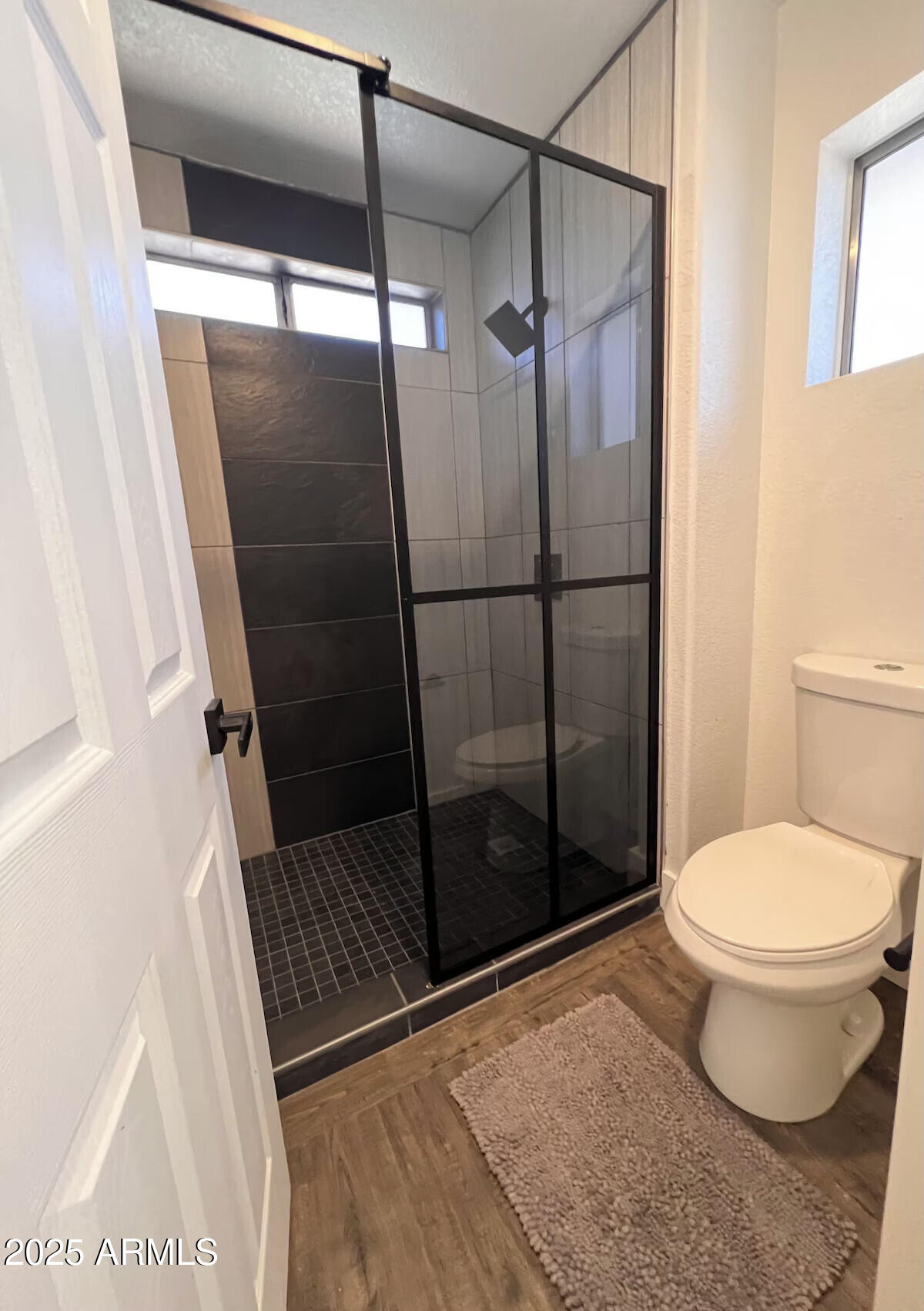 8322 West McLellan Road Glendale, AZ 85305 - Photo 24 of 30 a bathroom with a shower and a toilet