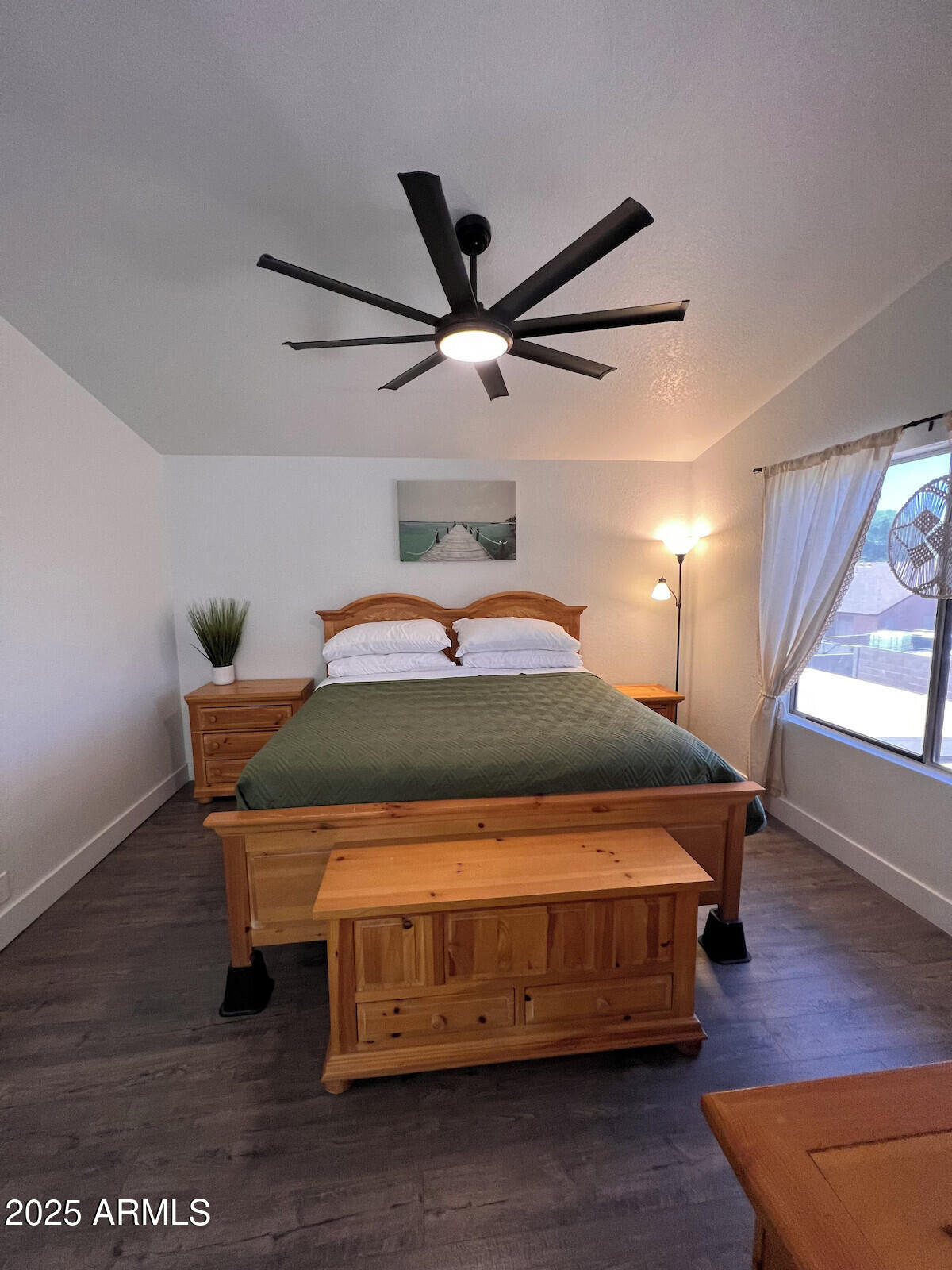 8322 West McLellan Road Glendale, AZ 85305 - Photo 28 of 30 a bedroom with a bed and wooden floor