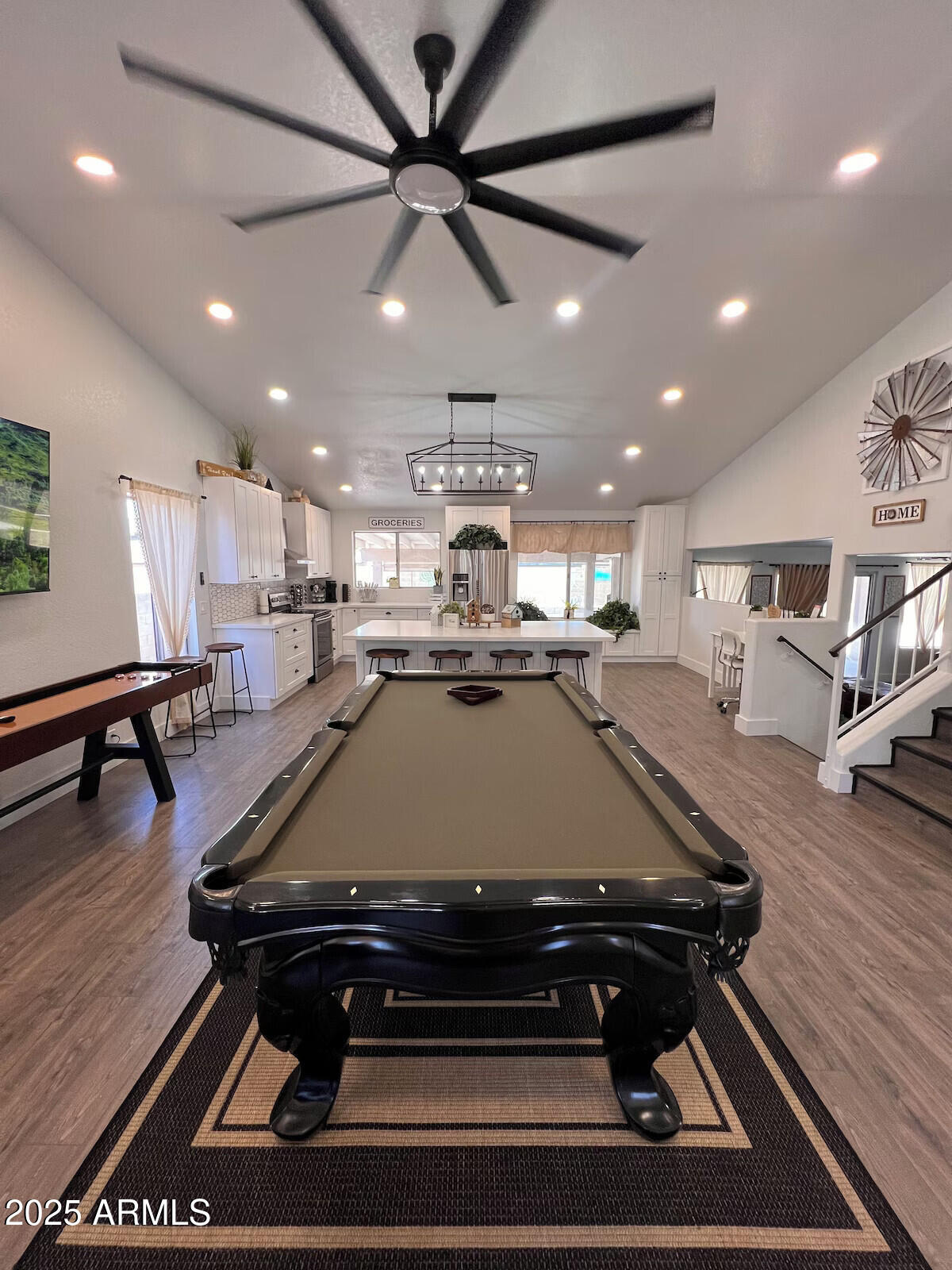 8322 West McLellan Road Glendale, AZ 85305 - Photo 6 of 30 a room with wooden floor pool table furniture and a chandelier