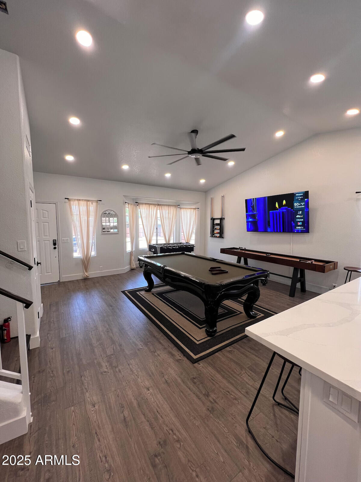 8322 West McLellan Road Glendale, AZ 85305 - Photo 9 of 30 a living room with hardwood floor and a ceiling fan