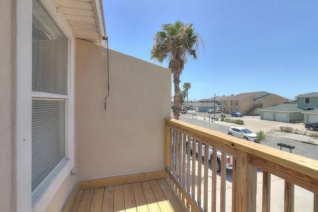 a view of a balcony with a trees