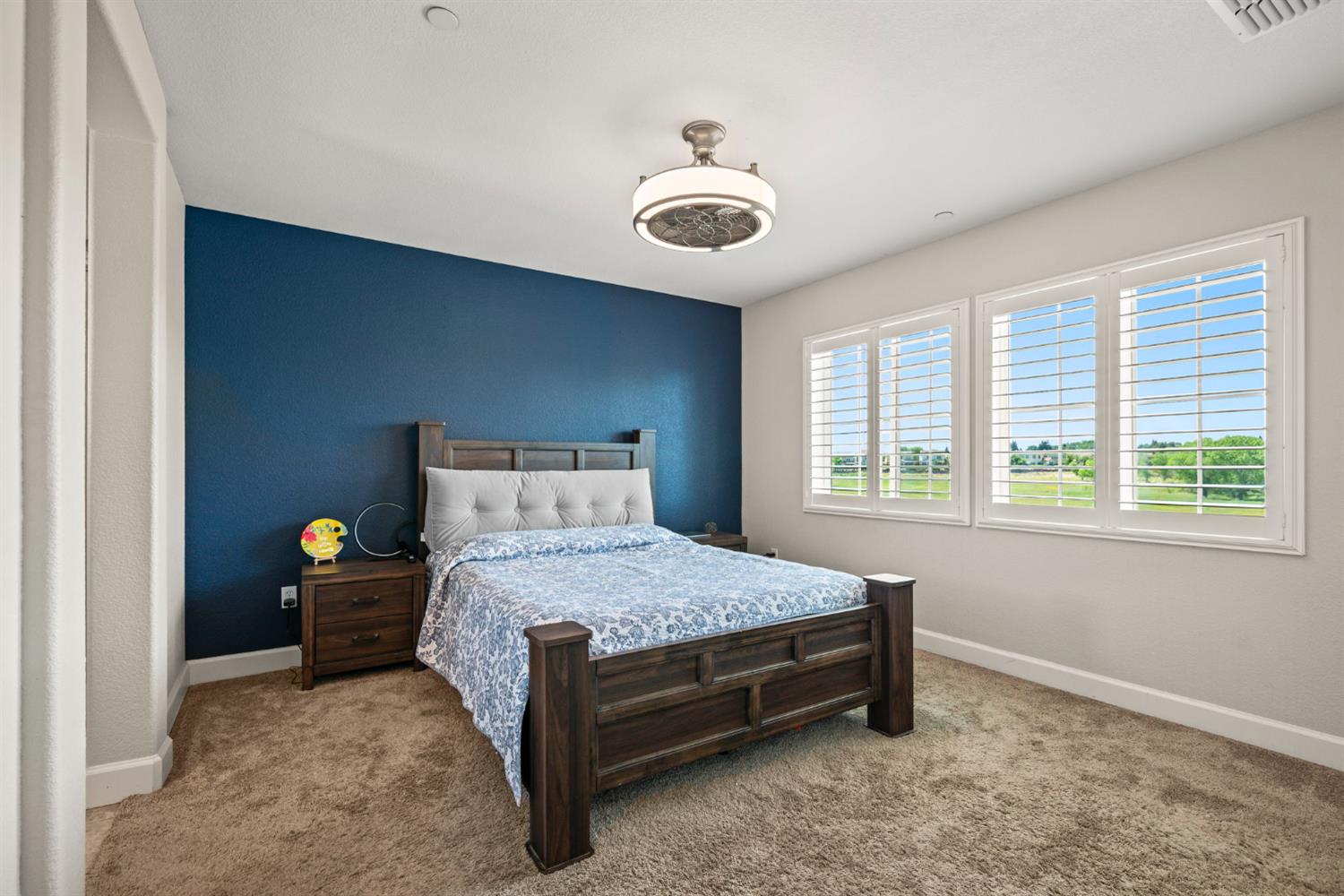 203 Rivage Circle, Unit 203 Folsom, CA 95630 - Photo 17 of 30 a bedroom with a bed and a window