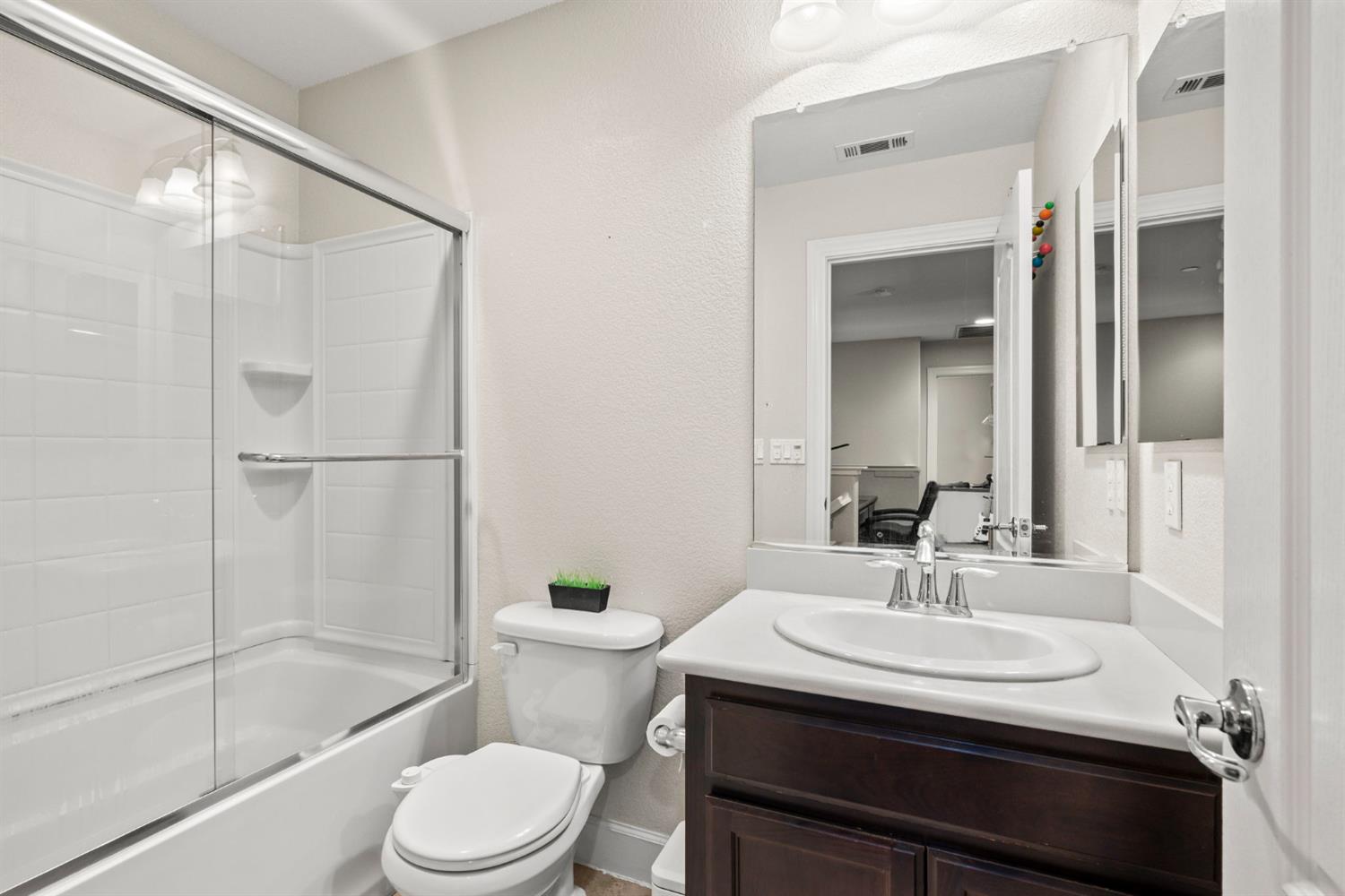 203 Rivage Circle, Unit 203 Folsom, CA 95630 - Photo 23 of 30 a bathroom with a sink toilet and shower