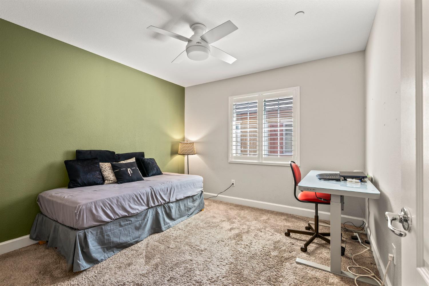 203 Rivage Circle, Unit 203 Folsom, CA 95630 - Photo 24 of 30 a bedroom with a bed a table and chair