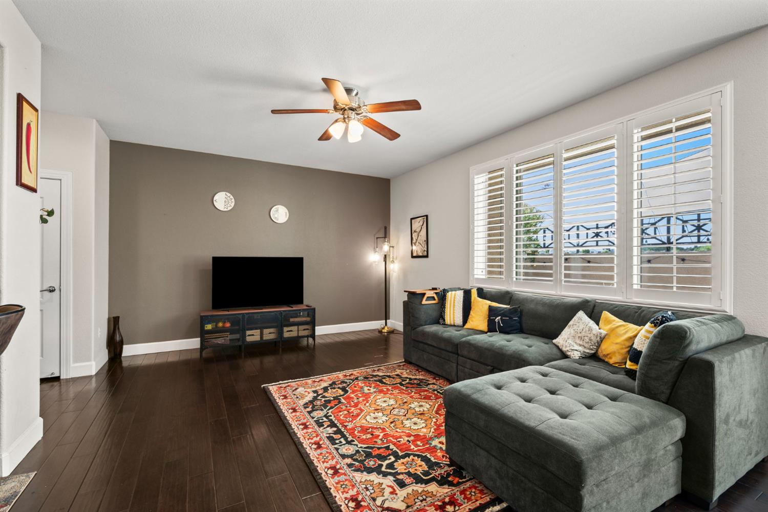 203 Rivage Circle, Unit 203 Folsom, CA 95630 - Photo 6 of 30 a living room with furniture and a flat screen tv