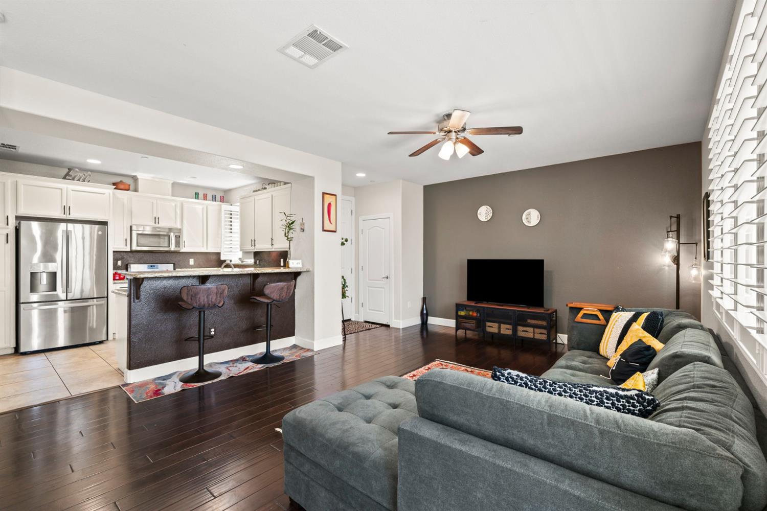 203 Rivage Circle, Unit 203 Folsom, CA 95630 - Photo 7 of 30 a living room with furniture and a flat screen tv