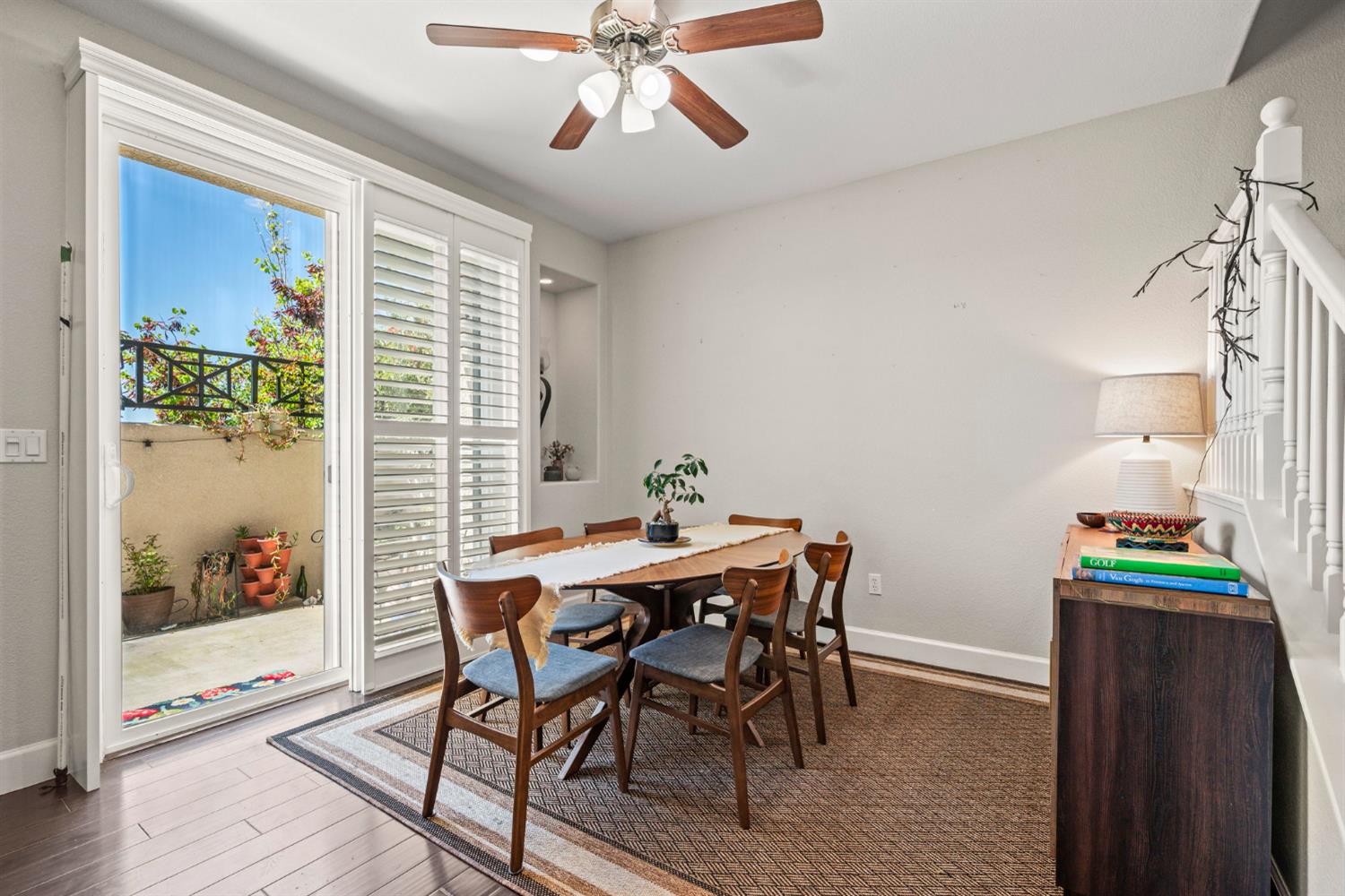 203 Rivage Circle, Unit 203 Folsom, CA 95630 - Photo 8 of 30 a view of a dining room with furniture and wooden floor