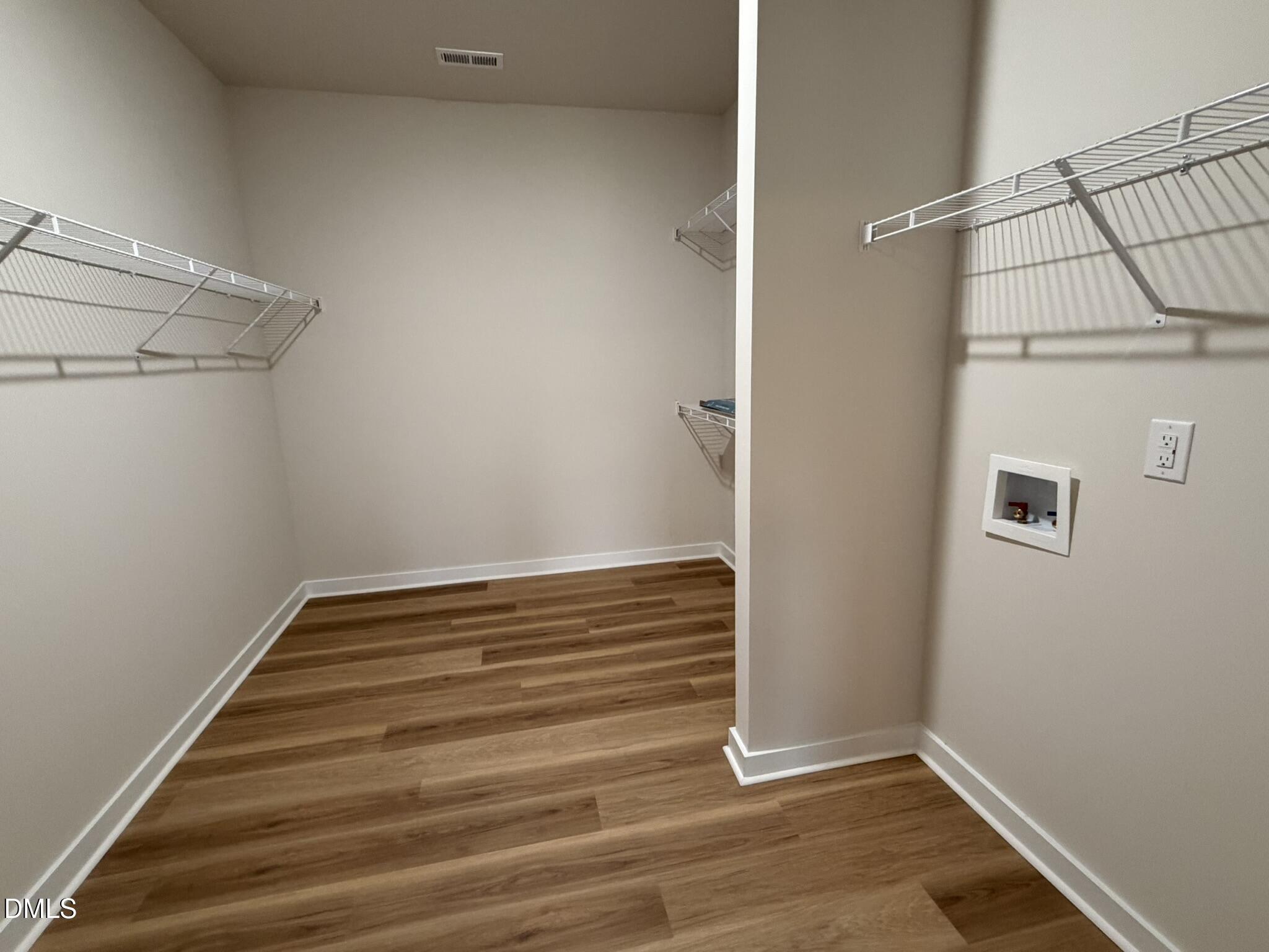 219 Jacobs Ridge Drive Four Oaks, NC 27524 - Photo 11 of 19 a view of a room with empty racks