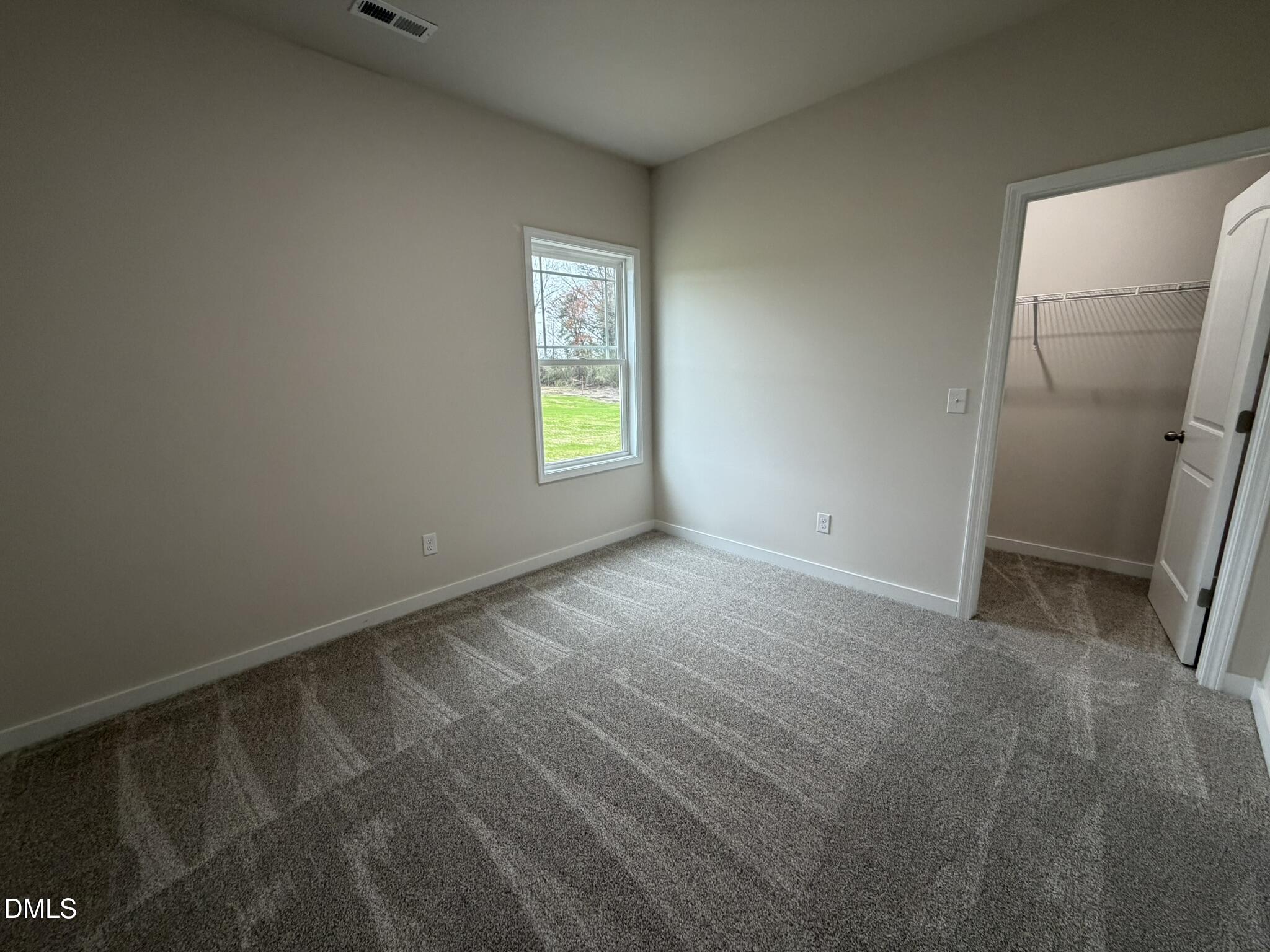 219 Jacobs Ridge Drive Four Oaks, NC 27524 - Photo 15 of 19 a view of an empty room with a window