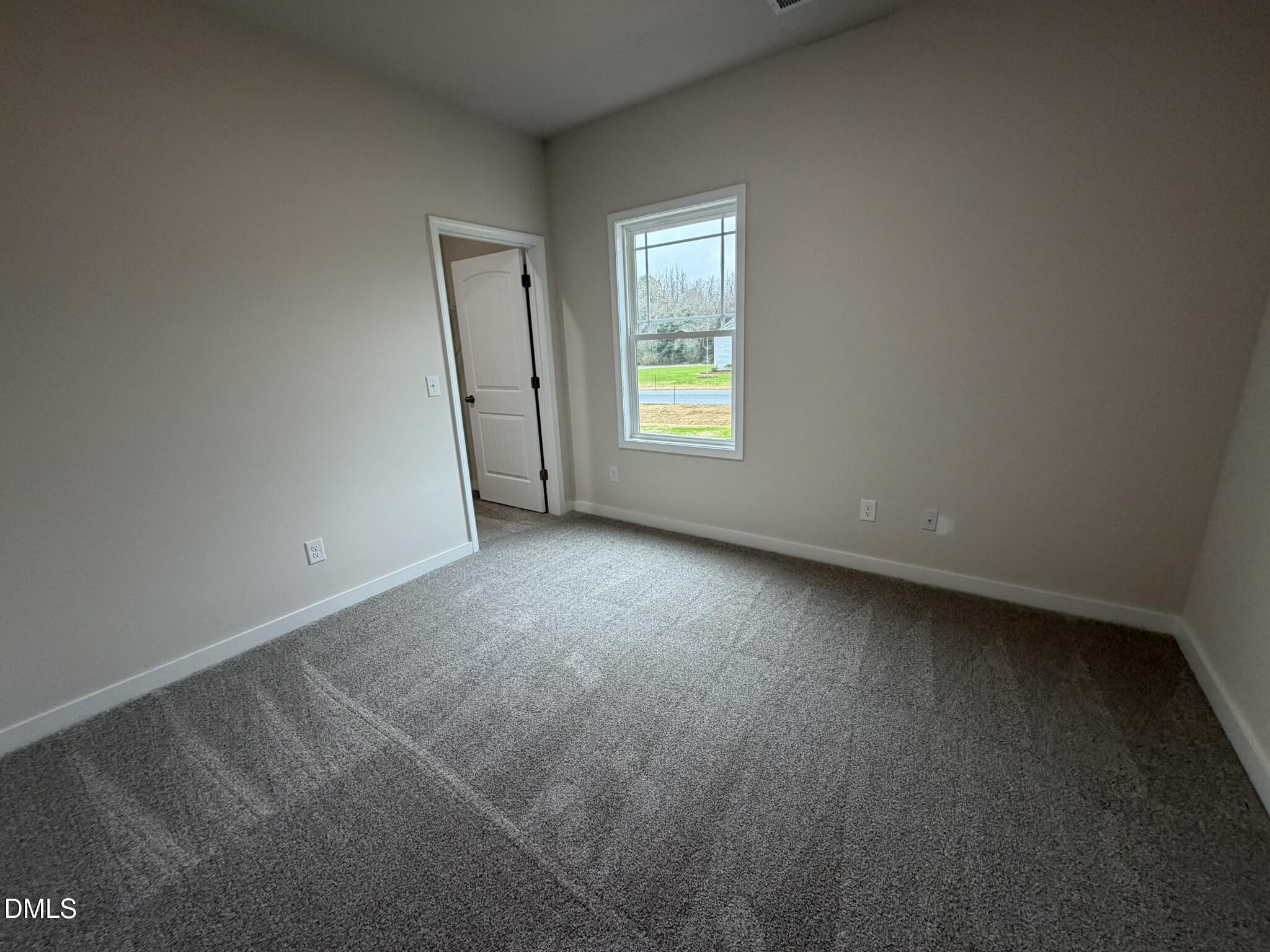 219 Jacobs Ridge Drive Four Oaks, NC 27524 - Photo 17 of 19 an empty room with a window