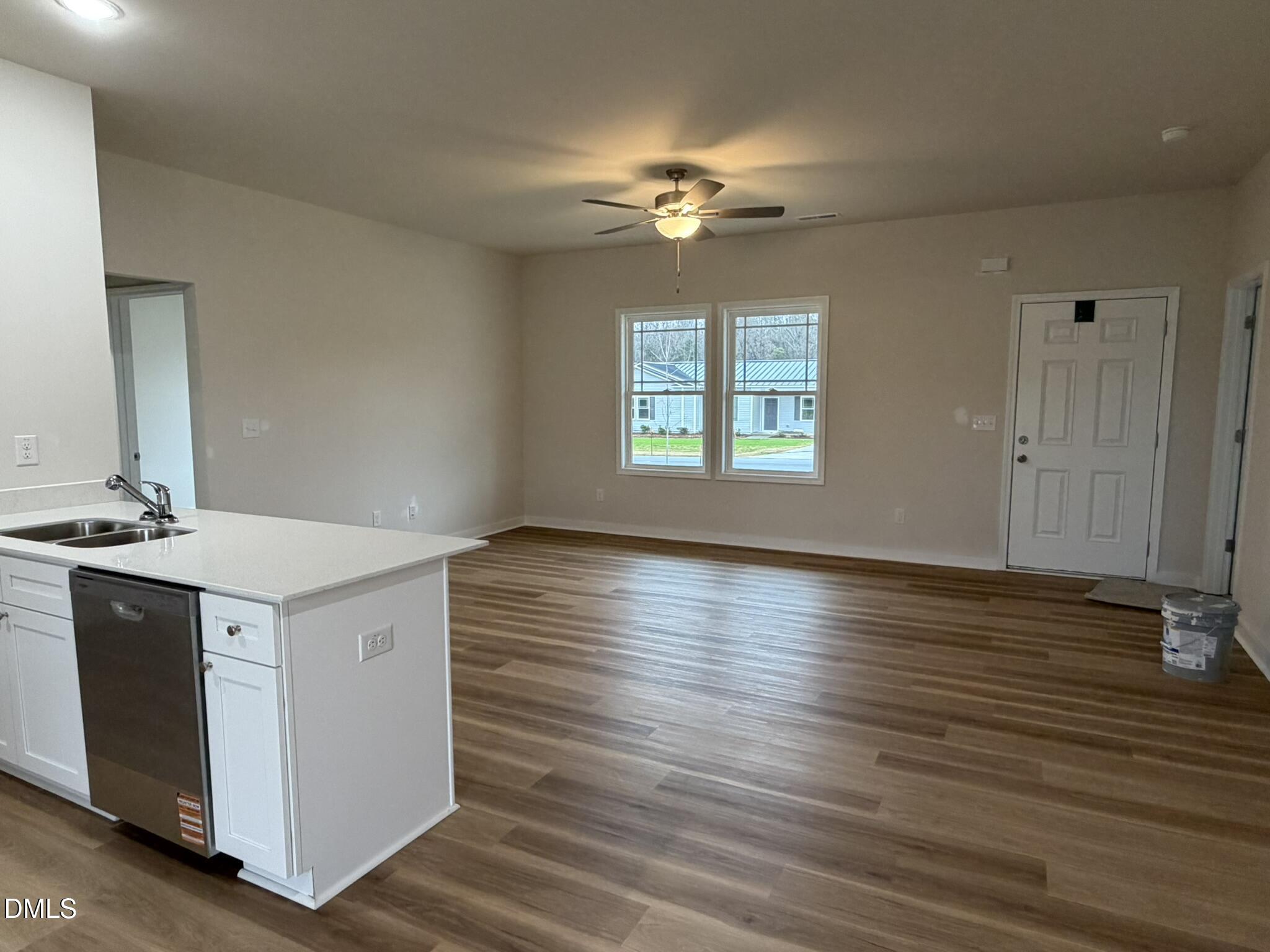 219 Jacobs Ridge Drive Four Oaks, NC 27524 - Photo 5 of 19 a view of a kitchen with a sink and dishwasher with wooden floor