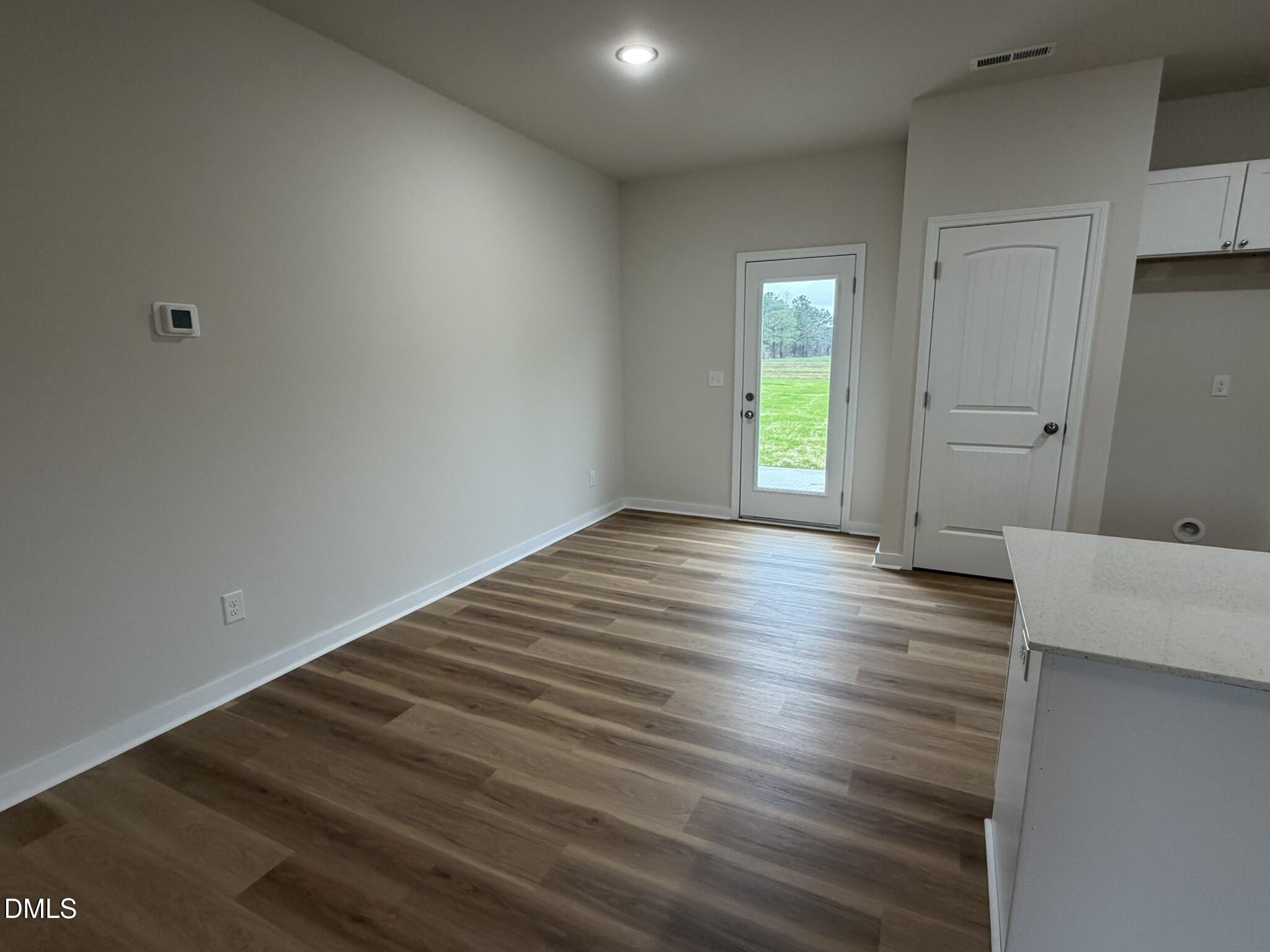 219 Jacobs Ridge Drive Four Oaks, NC 27524 - Photo 7 of 19 a view of wooden floor and windows in a room