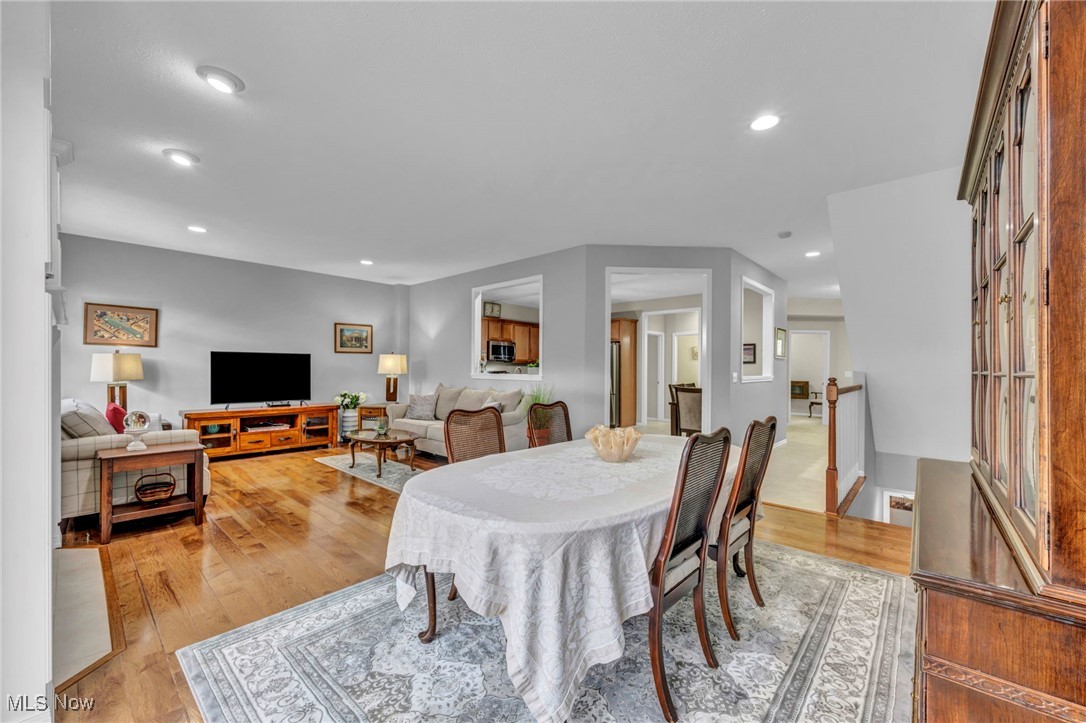 Dining space featuring light wood-type flooring and recessed lighting