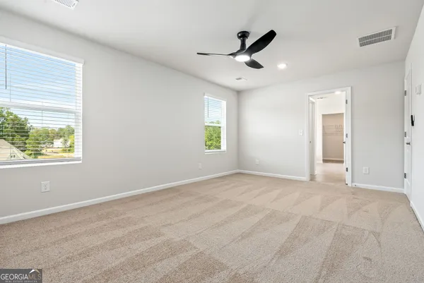 a view of an empty room with a window