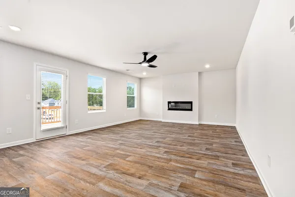 a view of an empty room with a window