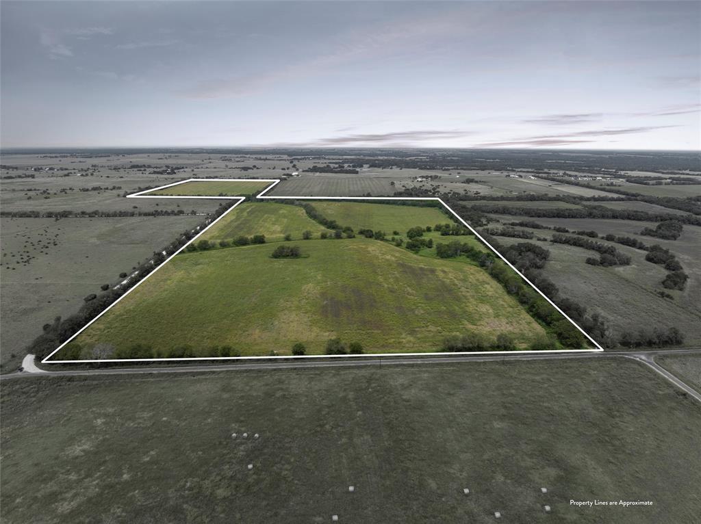 902 Mattlage Road Crawford, TX 76638 - Photo 2 of 32 Aerial view of sparsely populated area featuring property parcel outlined and extensive farmland