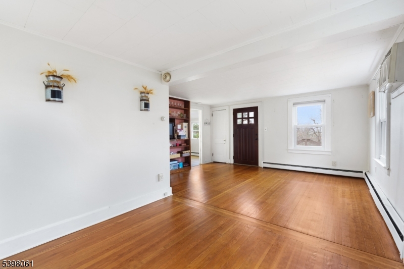 34 Old Mountain Road Lebanon, NJ 08833 - Photo 11 of 26 a view of an empty room with closet and wooden floor