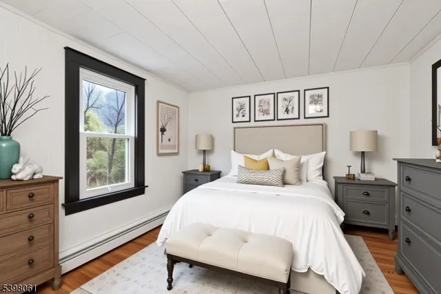 a view of a room with wooden floor and windows