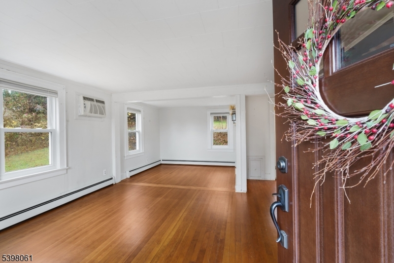 34 Old Mountain Road Lebanon, NJ 08833 - Photo 7 of 26 a view of an empty room with wooden floor and a window