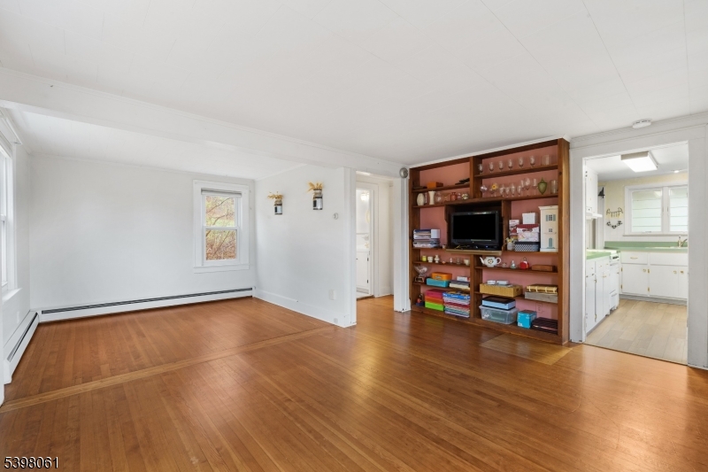 34 Old Mountain Road Lebanon, NJ 08833 - Photo 8 of 26 a view of a livingroom with wooden floor and a flat screen tv