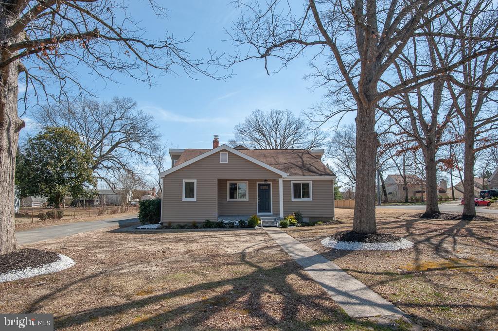 6525 Joyce Road Alexandria, VA 22310 - Photo 2 of 51 a front view of a house with a yard covered in snow