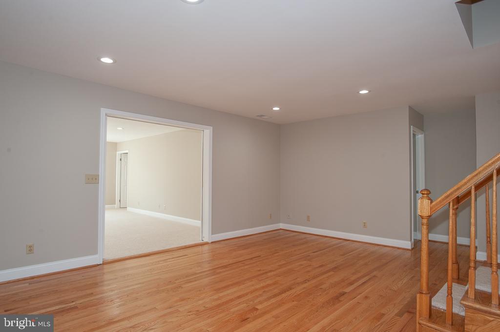 6525 Joyce Road Alexandria, VA 22310 - Photo 13 of 51 a view of an empty room with wooden floor and a window
