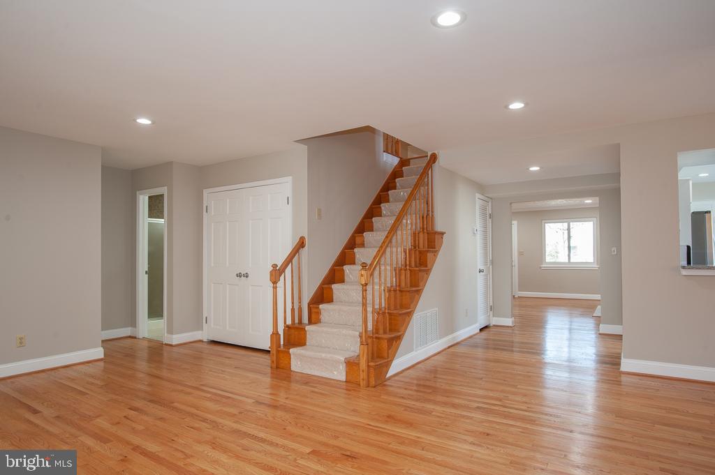 6525 Joyce Road Alexandria, VA 22310 - Photo 14 of 51 a view of an entryway with wooden floor and stairs