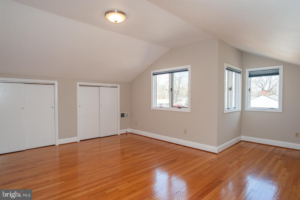 6525 Joyce Road Alexandria, VA 22310 - Photo 25 of 51 a view of an empty room with wooden floor and a window