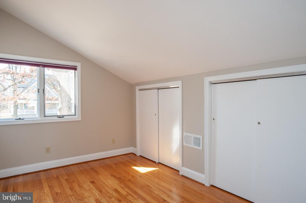 6525 Joyce Road Alexandria, VA 22310 - Photo 28 of 51 an empty room with wooden floor and windows