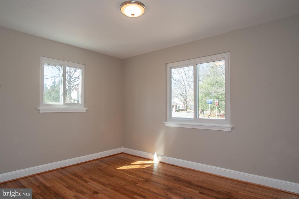 6525 Joyce Road Alexandria, VA 22310 - Photo 41 of 51 a view of an empty room with wooden floor and a window