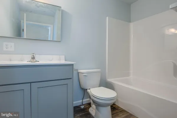 a bathroom with a sink toilet and vanity