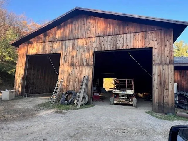 a view of house and car garage