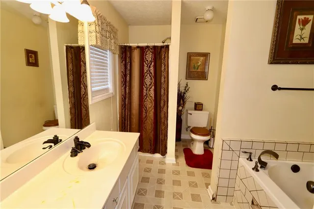 a bathroom with a shower and a toilet